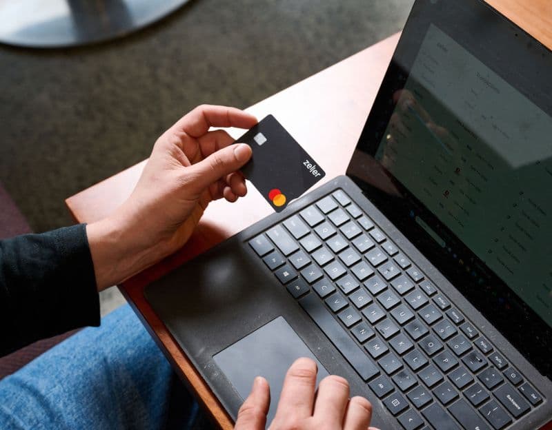 Zeller – Debit Card and Laptop